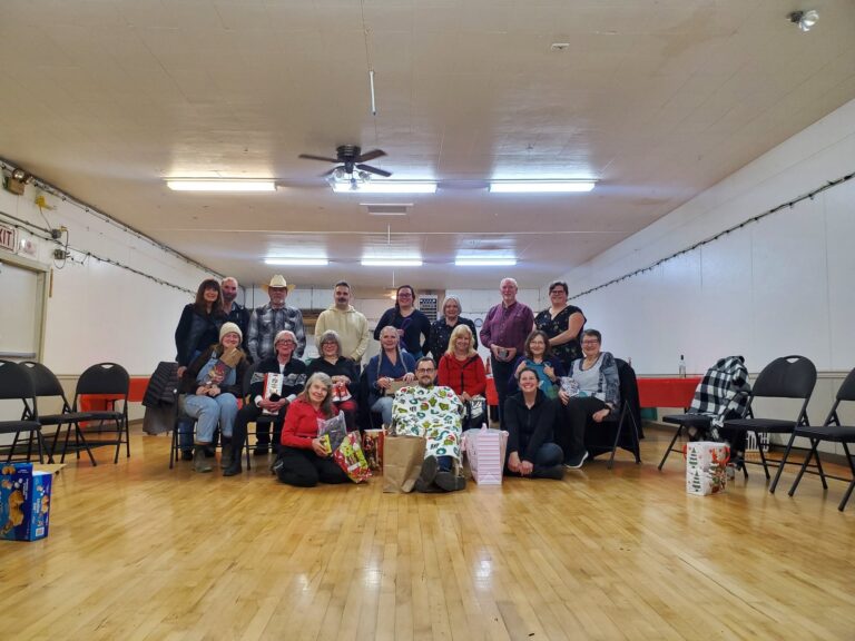 Haney Horsemen members gathered in a hall for a club meeting
