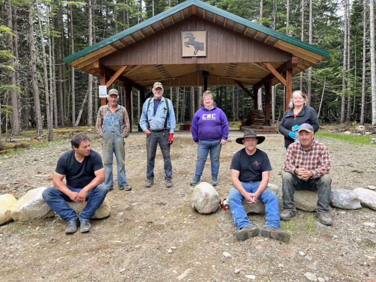Robson Valley Chapter members in front of the timber picnic shelter