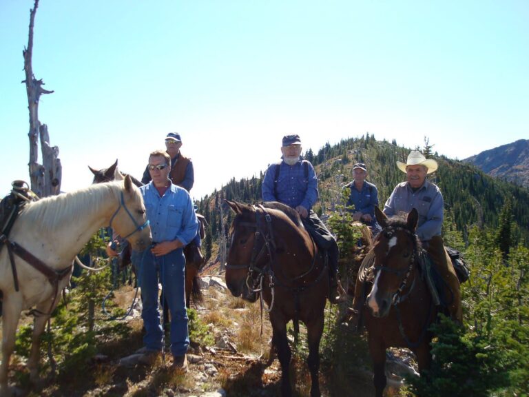West Kootenay Chapter riders on horseback under a sunny sky