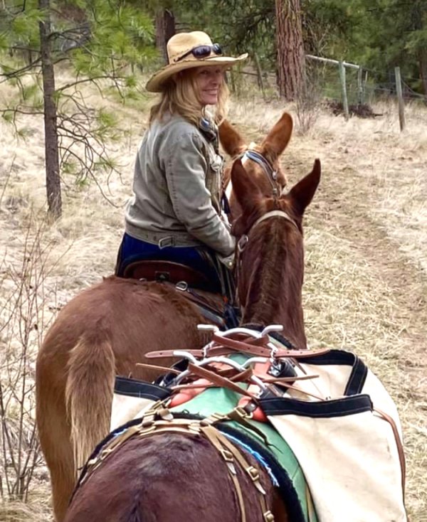 Juanita Gibney, BCHBC Vice President, on horseback on a trail