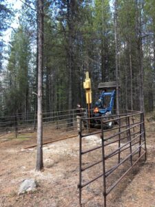 Mini excavator installing horse pens at Trapping Creek camp