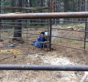 Sully welding a horse pen at Trapping Creek camp