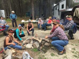 Work crew taking a break while installing horse pens at Trapping Creek