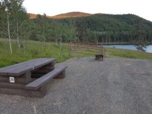 Picnic table at a campsite overlooking Harmon Lake