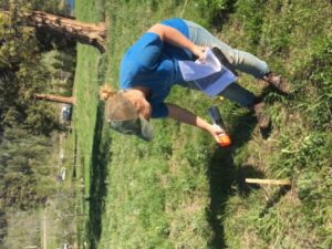 Volunteer installing posts at the Kane Valley equestrian campground