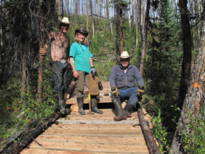 Volunteers on a newly built boardwalk in the forest