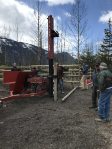Post pounder machine installing corral posts at the Moose River staging area